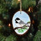 A hand-painted backyard bird wood slice ornament available at Cove Creek Photography.